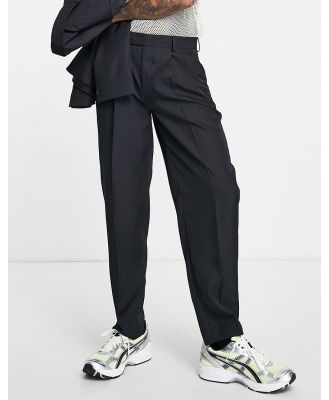 ASOS DESIGN oversized tapered suit pants in black