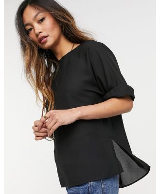 ASOS DESIGN oversized woven tee with roll sleeve in black-White