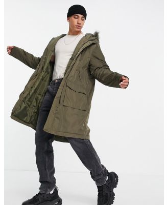 ASOS DESIGN parka jacket in green with faux fur trim hood