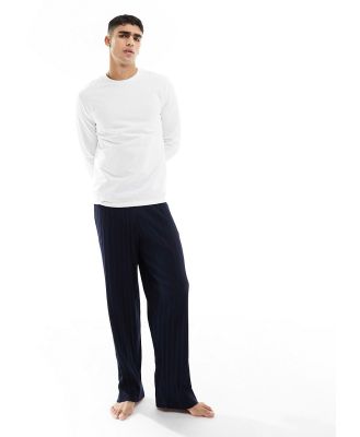 ASOS DESIGN pyjama set with long sleeve white t-shirt and ribbed navy bottoms