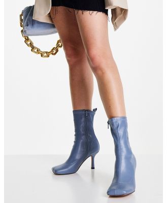 ASOS DESIGN Roma square toe heeled sock boots in blue