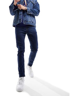 ASOS DESIGN skinny jeans in flat dark wash blue