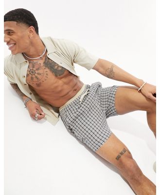 ASOS DESIGN slim textured shorts in shorter length in check-Multi