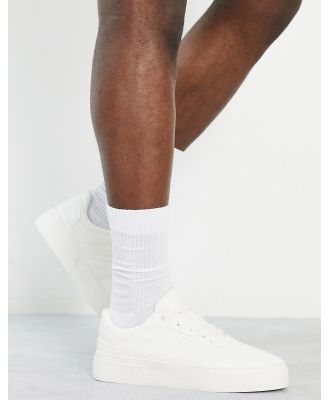 ASOS DESIGN sneakers in white with chunky sole