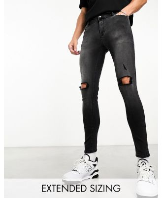 ASOS DESIGN spray on jeans with power stretch denim with knee rips in washed black