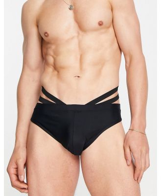 ASOS DESIGN swim briefs with cut out detail in black