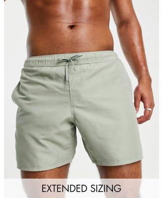 ASOS DESIGN swim shorts in mid length in light green