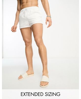 ASOS DESIGN swim shorts in super short length in white
