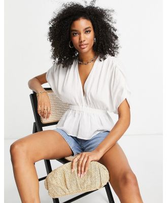 ASOS DESIGN textured plunge front top with elastic waist detail in white