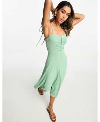ASOS DESIGN textured strappy midi tea dress with hook and eye detail in sage green