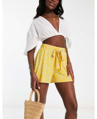 ASOS DESIGN tie belt flippy shorts in mustard ditsy floral-Multi