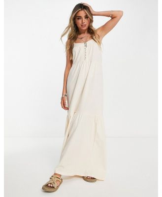 ASOS DESIGN tiered cami maxi dress with faux shell buttons in cream-Neutral