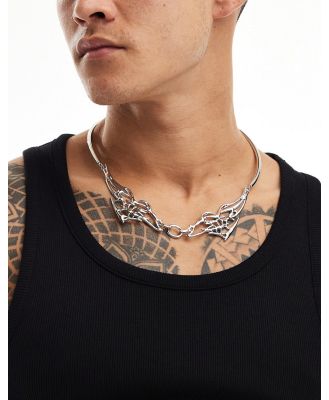 ASOS DESIGN torque necklace with tattoo design in silver tone
