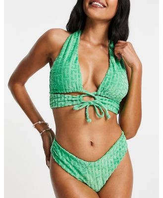 ASOS DESIGN towelling graphic lace-up halter bikini top in green