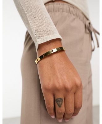 ASOS DESIGN waterproof stainless steel bangle with celestial design-Gold
