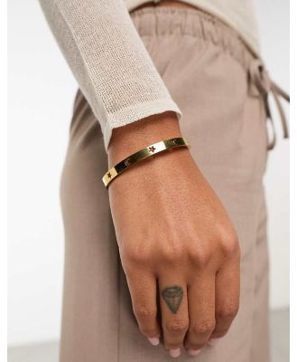 ASOS DESIGN waterproof stainless steel bangle with celestial design in gold tone