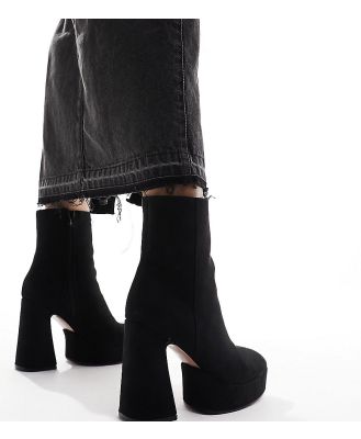 ASOS DESIGN Wide Fit Enchant heeled platform boots in black micro