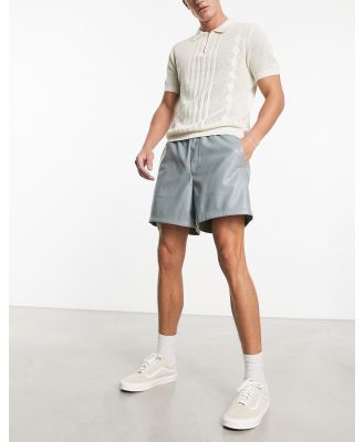 ASOS DESIGN wide leather look shorts in mid length in green