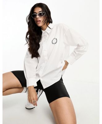 ASOS Weekend Collective oversized shirt with embroidered circle logo in white