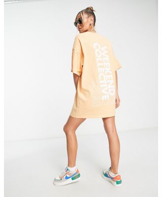 ASOS Weekend Collective oversized t-shirt dress with back graphic in apricot-Orange