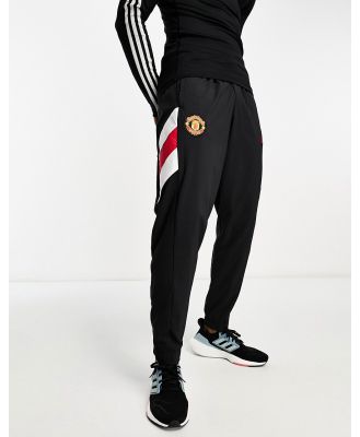 adidas Football Manchester United FC Icons trackies in black