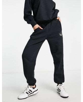 adidas Originals Mountain Explorer contrast cuffed trackies in black