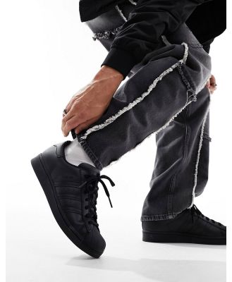 adidas Originals Superstar sneakers in triple black