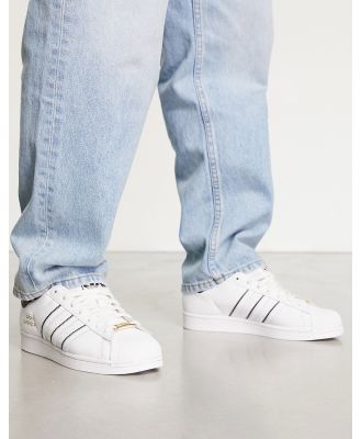 adidas Originals Superstar sneakers in white with contrast stripes