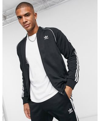 adidas Originals Superstar three stripe track jacket in black