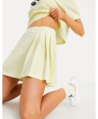 adidas Originals 'Tennis Luxe' logo pleated skirt in hazy yellow