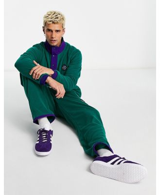 adidas Originals 'Wander Hour' fleece pants in dark green