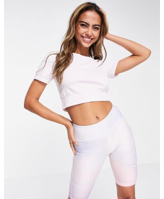 adidas Training seamless panelled short sleeve cropped top in light pink