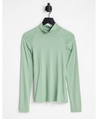 Aligne high neck top with ruched shoulder in green