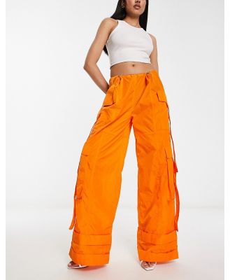 Annorlunda nylon oversized parachute pants in bright orange