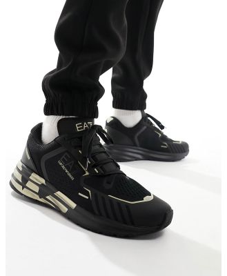 Armani EA7 gold logo flyknit nylon mesh sneakers in triple black / gold