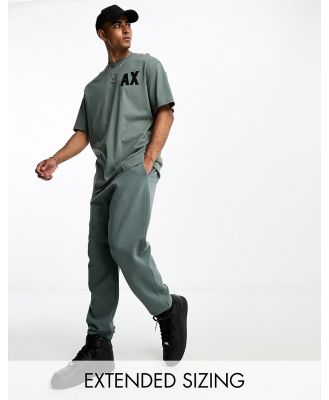 Armani Exchange logo trackies in dark green mix and match