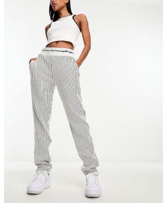Armani Exchange tapered fit stripe trackies in off white