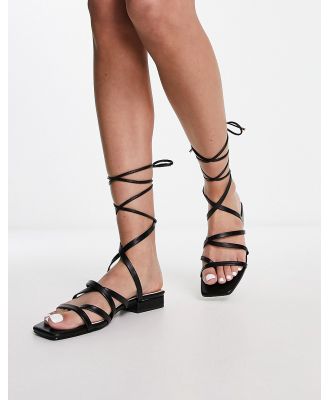 Bebo Vinny strappy tie leg flat sandals in black