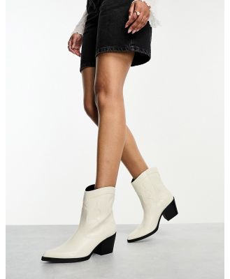 Bershka faux leather cowboy boots in off white