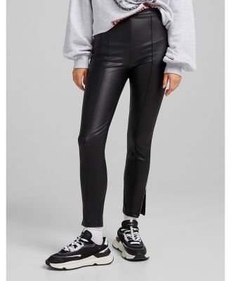Bershka faux leather skinny pants with zip hem in black