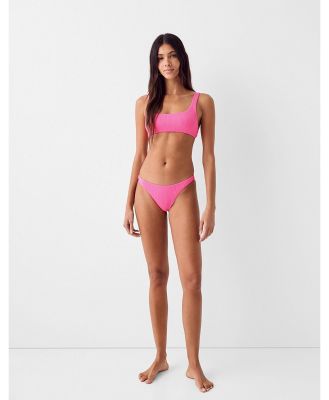 Bershka scoop neck crinkle bikini top in bright pink (part of a set)