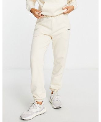 Carhartt WIP relaxed trackies with small logo in cream (part of a set)-White