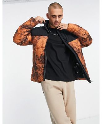 Champion small logo puffer jacket in orange and black