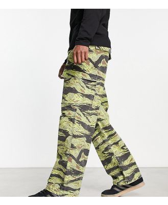 COLLUSION festival washed camo printed cargo pants in black and green