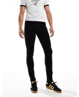 COLLUSION mid rise skinny jeans in black