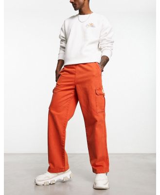 Damson Madder worker chino pants in washed red