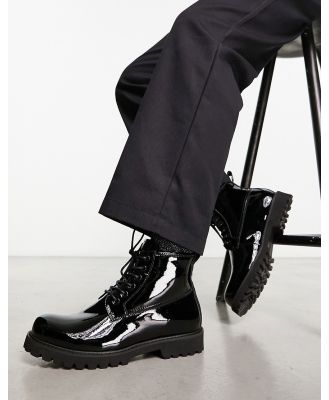 Devil's Advocate chunky patent leather lace up boots in black