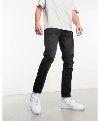 DTT rigid slim fit ripped jeans in washed black