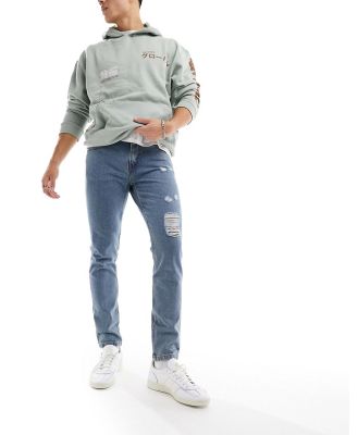 DTT rigid tapered fit ripped jeans in mid blue