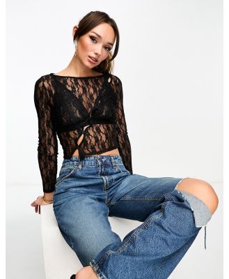 Edited sheer lace top in black